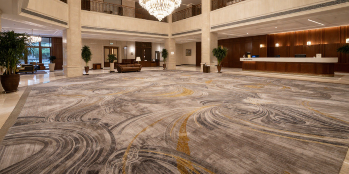 Luxury Carpets In The UAE Featured In A Modern Hotel Lobby With Marble Interior Design