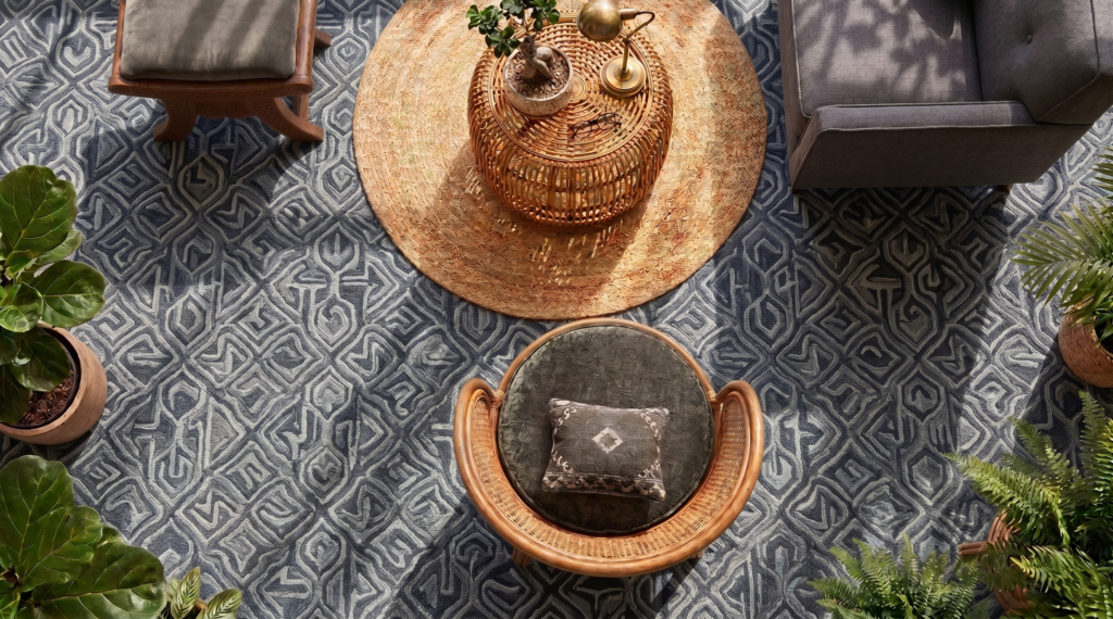 Stylish living space featuring patterned carpet tiles with modern furniture and decor